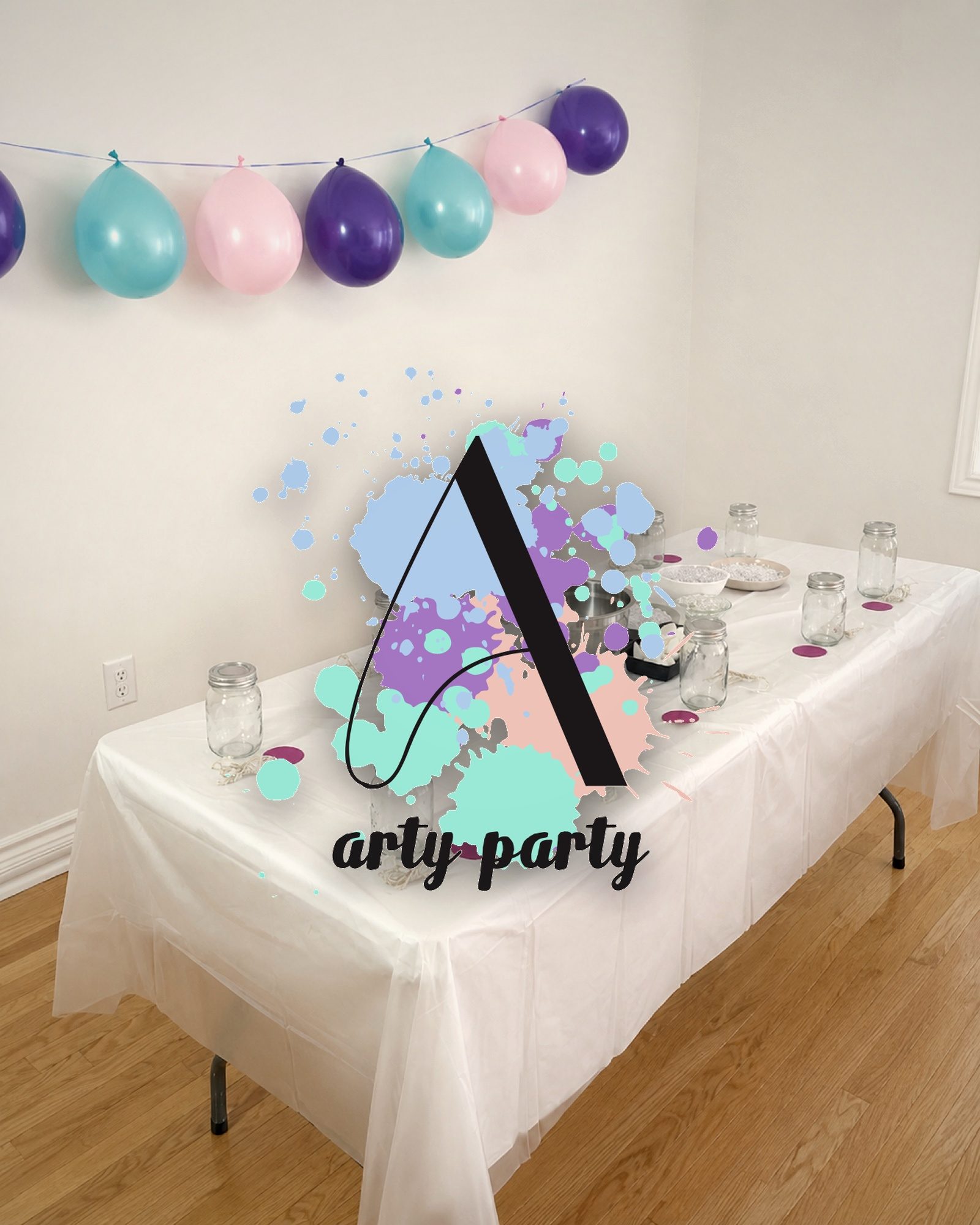 The lockup at full shout over a real party setup — the balloon garland already matched the palette before the logo landed.