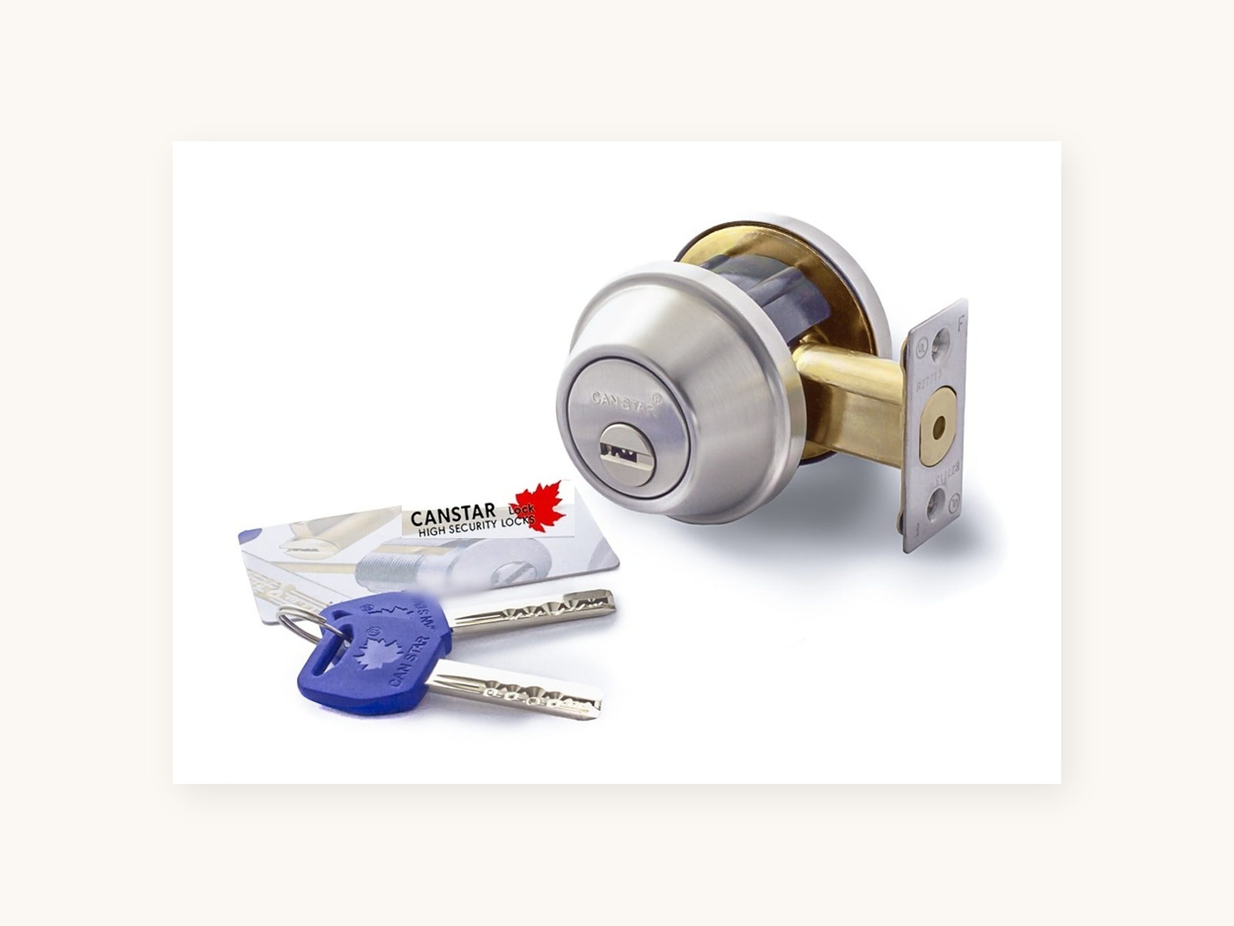 The real card that ships in every box — the customer's key-ID card, shot with the deadbolt and its two blue-capped keys.