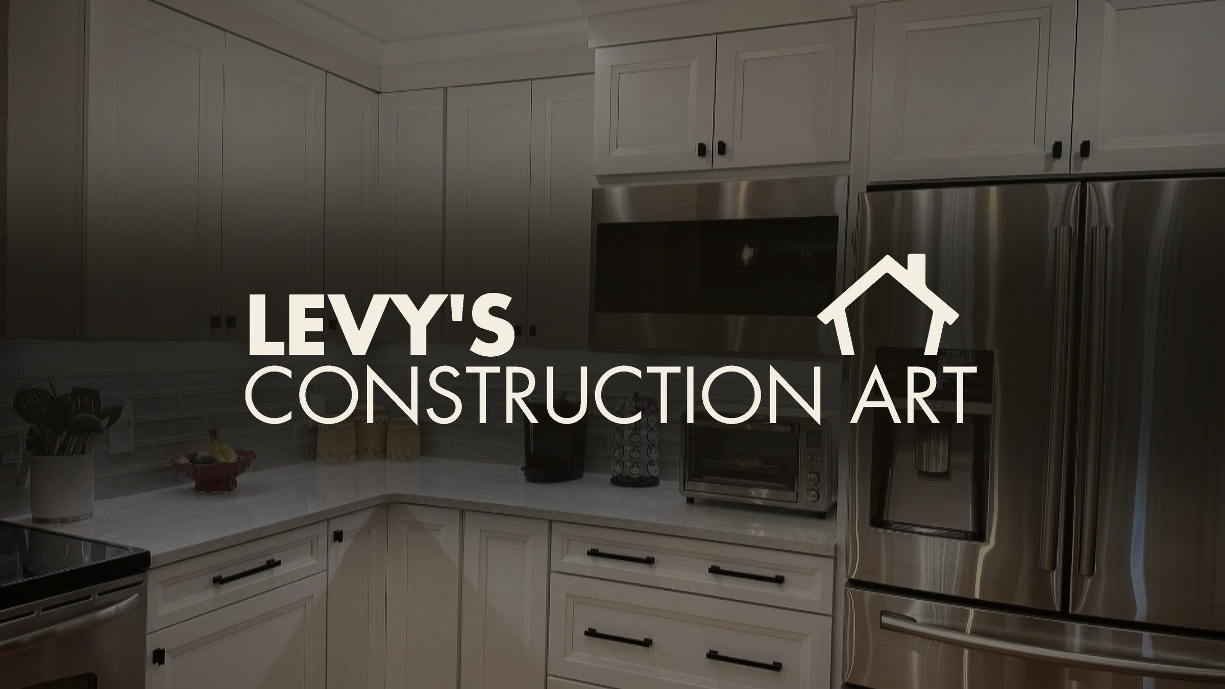 The lockup at full width over a kitchen the crew actually built — the mark in cream, the room doing the talking.