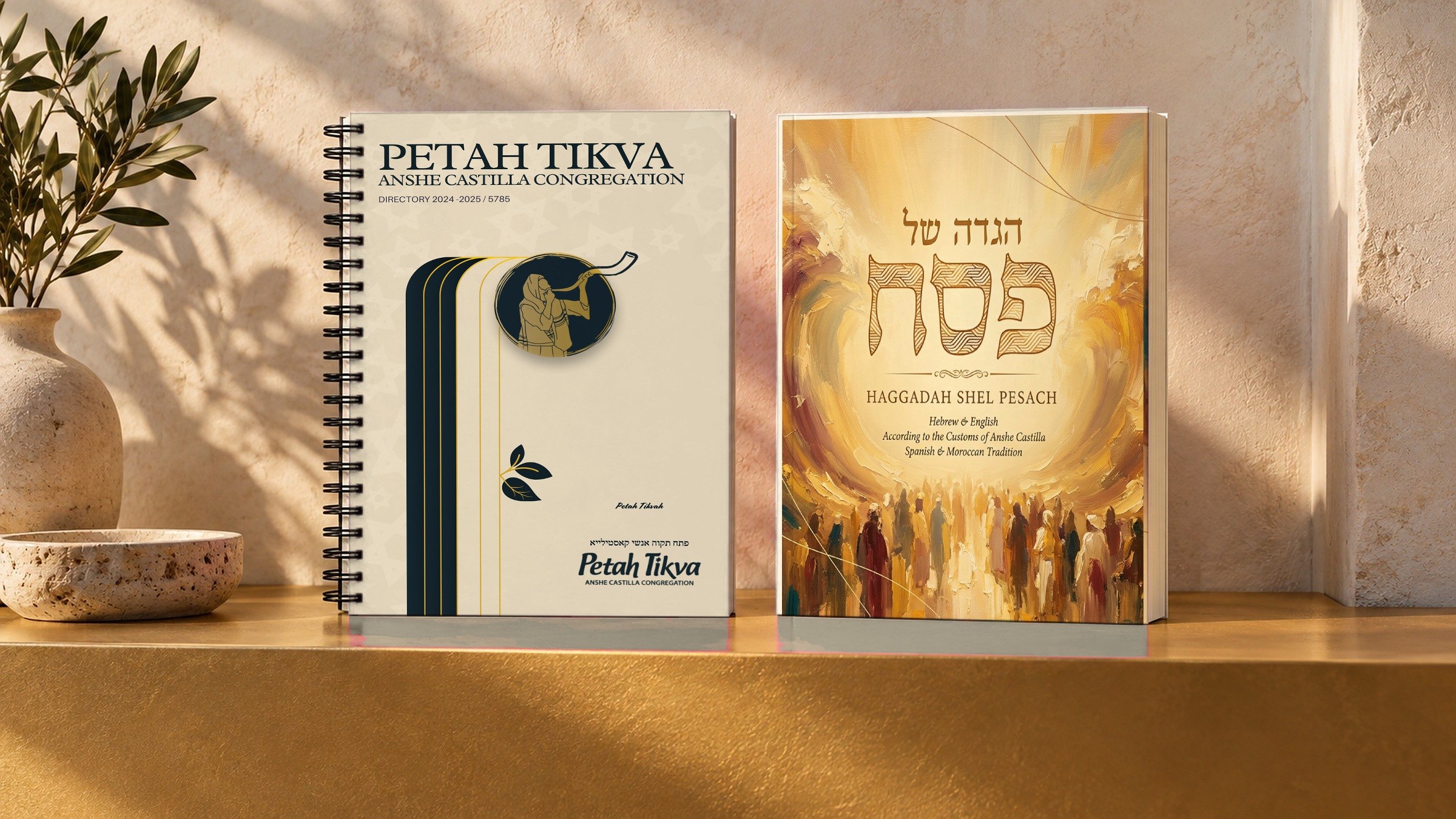 The directory and the Haggadah side by side on a gold ledge.